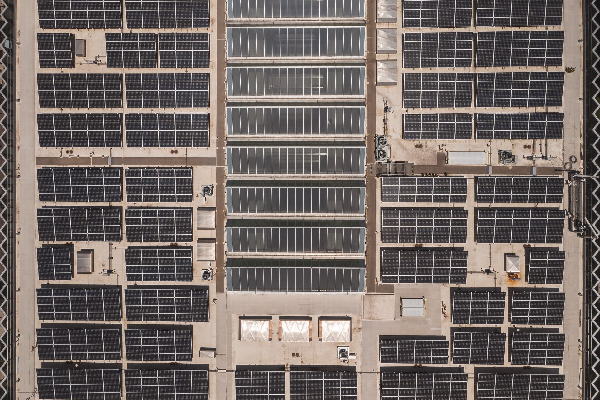 Aerial view of solar panels on an industrial rooftop